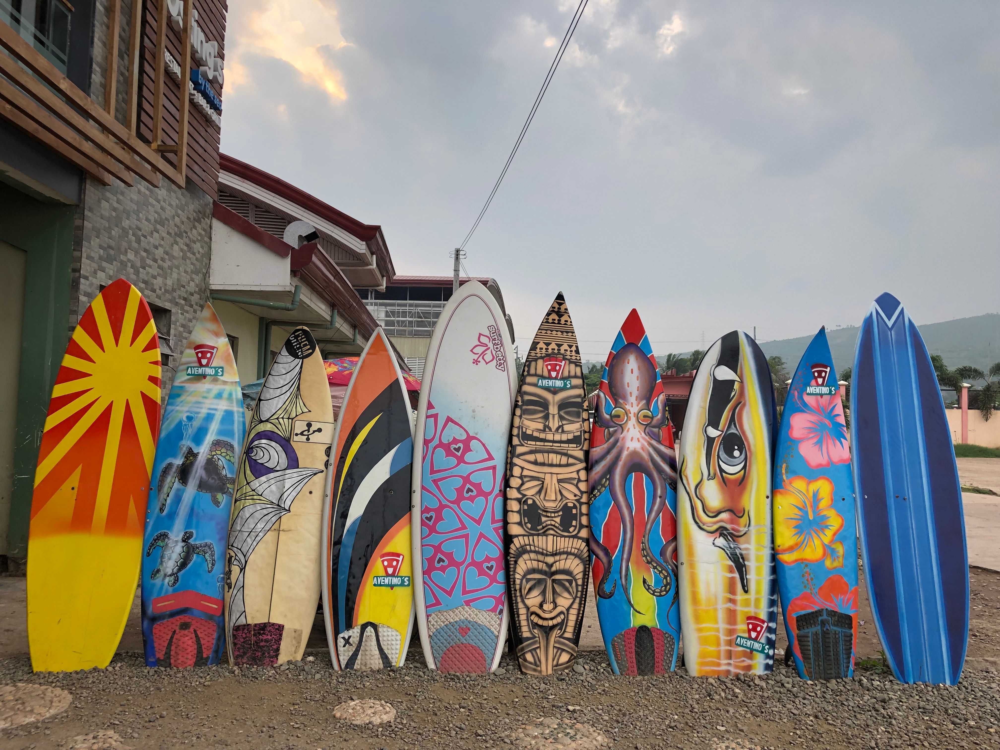 Surfboards lined up on the beach